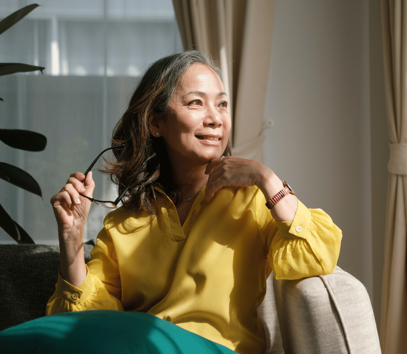 Woman Sitting in Chair Looking Out of Window